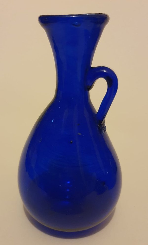 rounded, flared necked blue glass vase