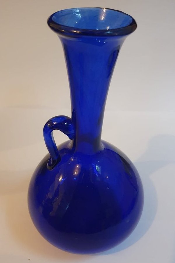 Long-necked blue glass vase