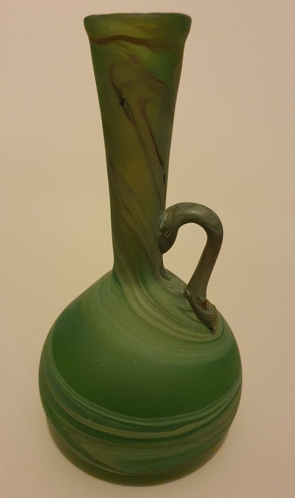 Round bodied, long flared neck. green marbled glass vase