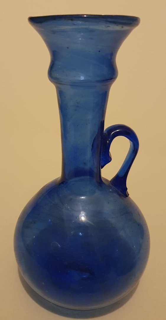 Round bodied, long, stepped neck blue glass vase