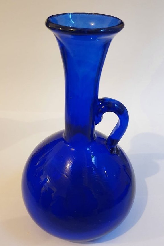 Round body, long necked blue vase