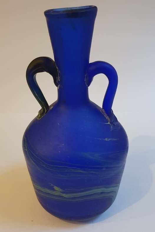 Wide bodied, two handled, blue marbled glass vase